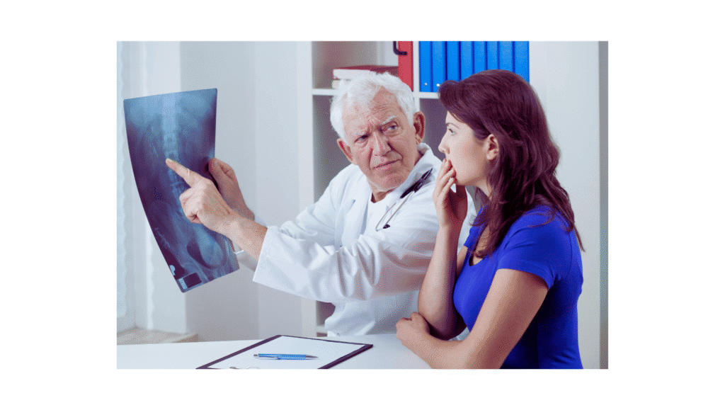 Chiropractor reviewing xray with patient