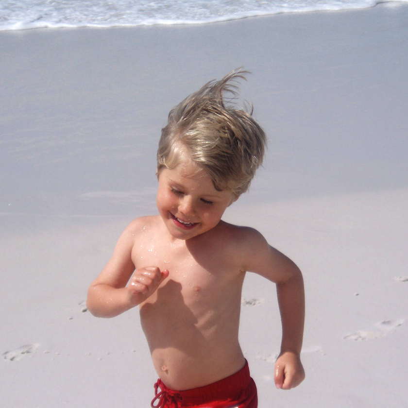 A child running on a beach, representing gentle children's chiropractic care at Farrelly Chiropractic Narre Warren