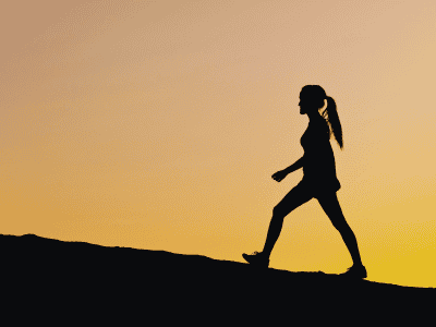 Walking for back pain silhouette sunset